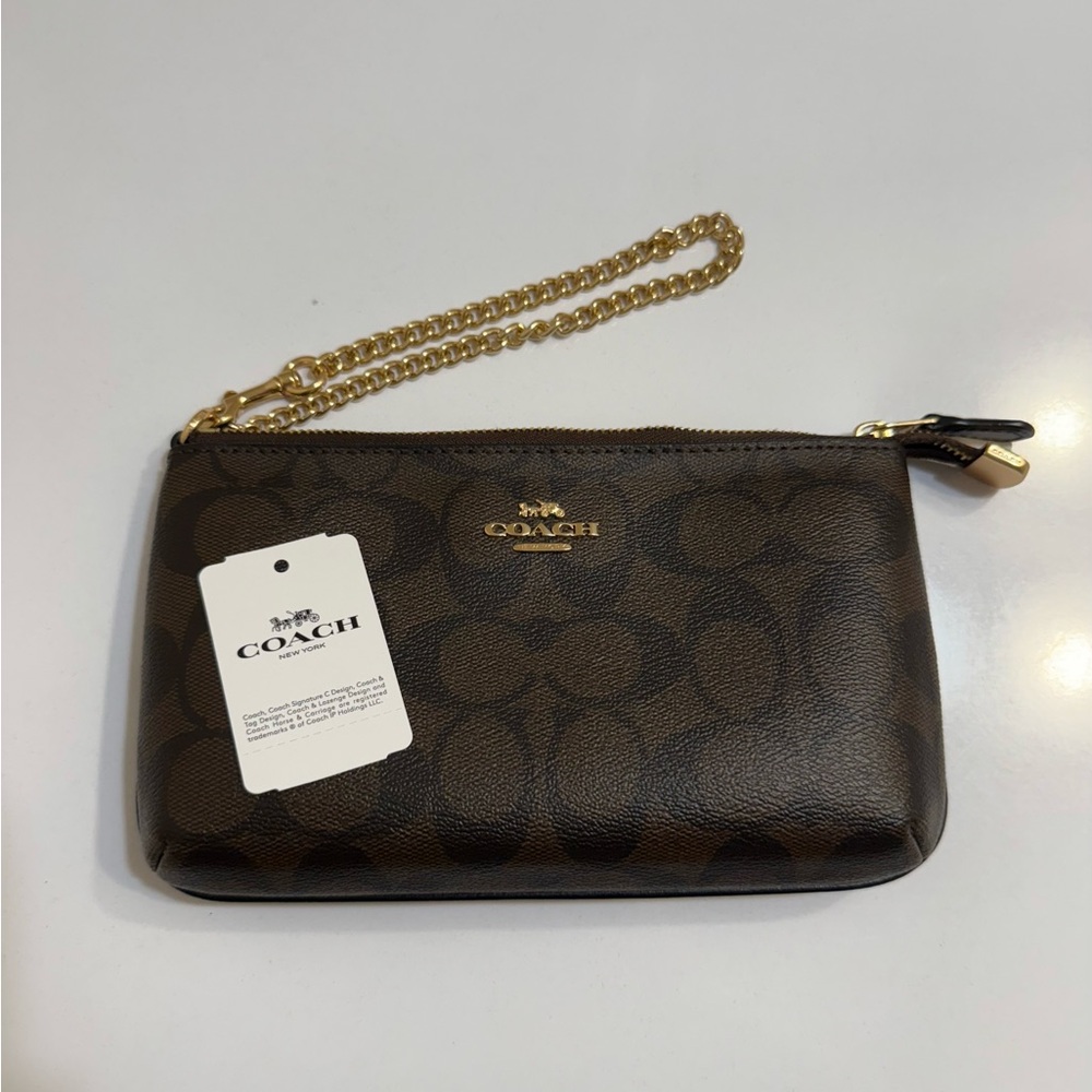 Coach Large Wristlet in Signature Canvas.